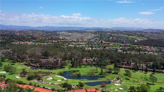 drone / aerial view with a water and mountain view