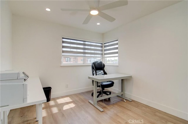 office area featuring light hardwood / wood-style flooring and ceiling fan