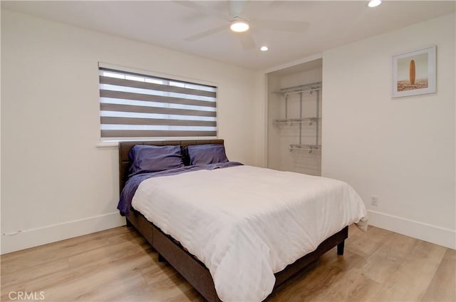 bedroom featuring light wood-type flooring and ceiling fan