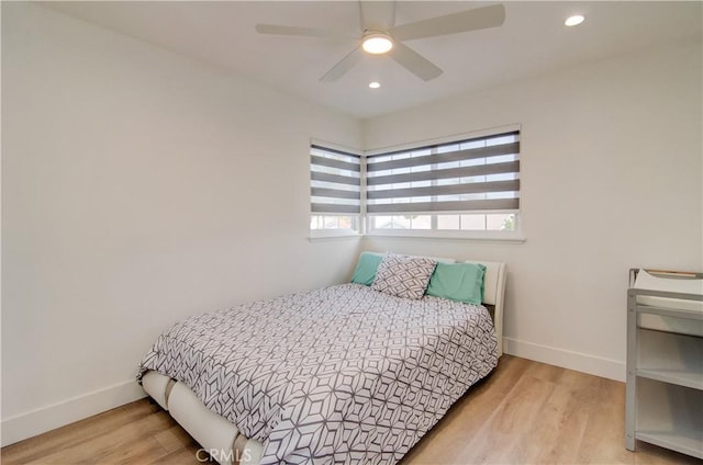 bedroom featuring ceiling fan and light hardwood / wood-style floors