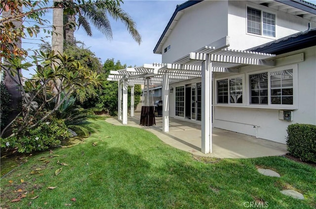 view of yard with a pergola and a patio area