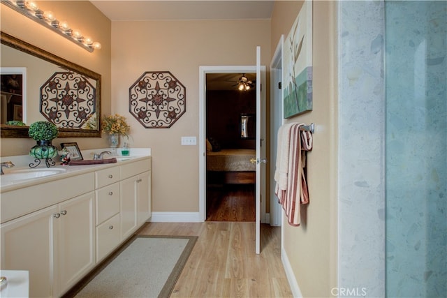 bathroom with vanity and wood-type flooring