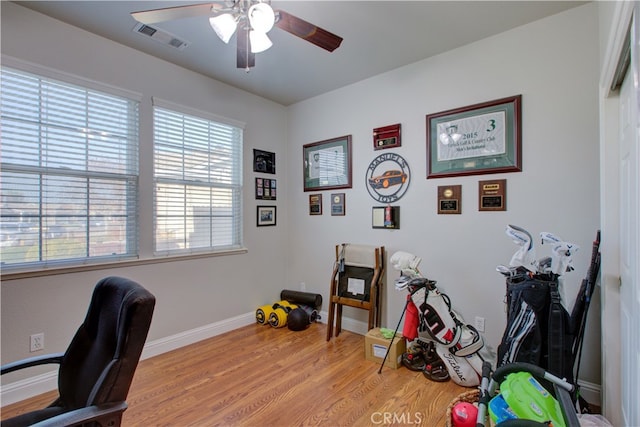 office space with ceiling fan and light wood-type flooring