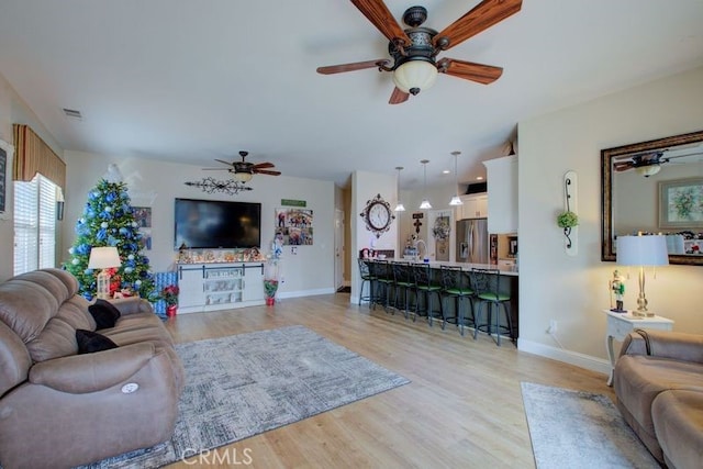 living room with light hardwood / wood-style flooring