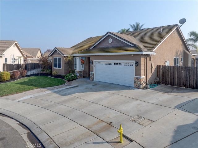 view of front of house with a front lawn and a garage