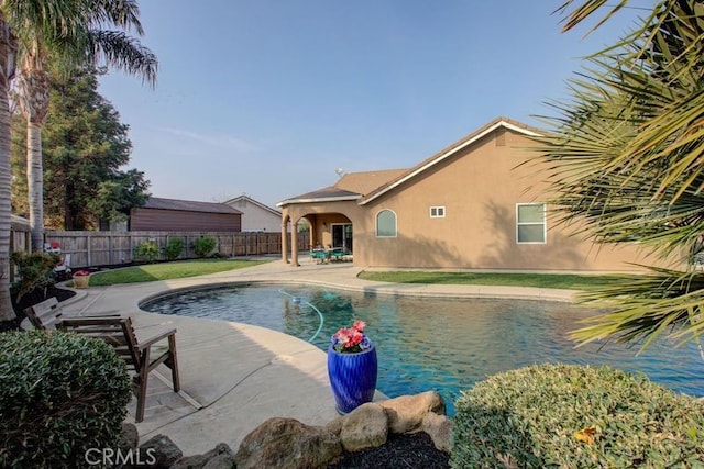 view of pool featuring a patio