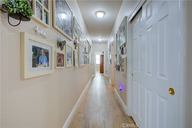 hall with light wood-type flooring