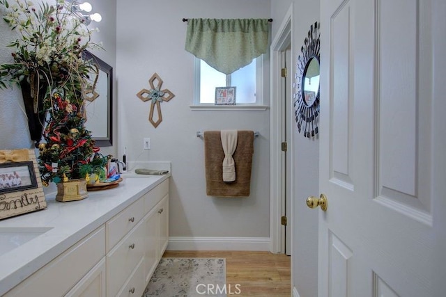 bathroom featuring hardwood / wood-style floors and vanity