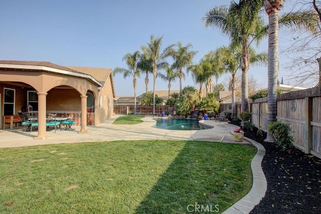 view of yard featuring a fenced in pool and a patio area