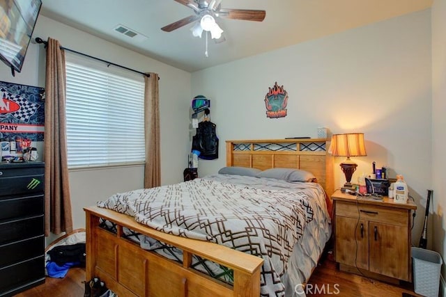 bedroom featuring ceiling fan and dark hardwood / wood-style floors