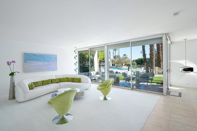 living room featuring floor to ceiling windows and light tile patterned floors