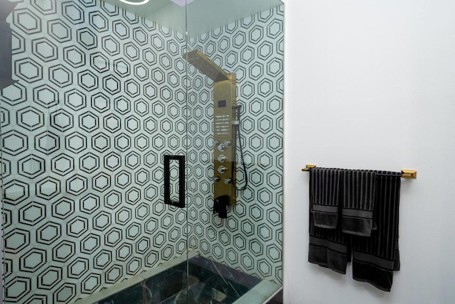 bathroom with a tile shower