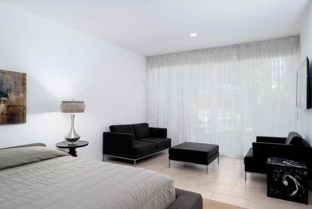 bedroom with light tile patterned floors