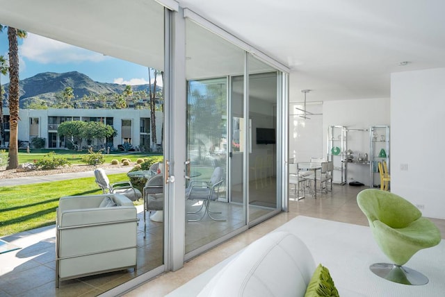 doorway to outside featuring a mountain view and french doors