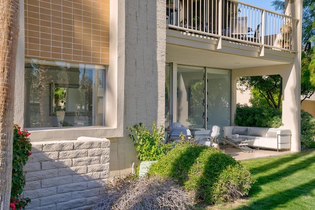 entrance to property with a patio area and a balcony