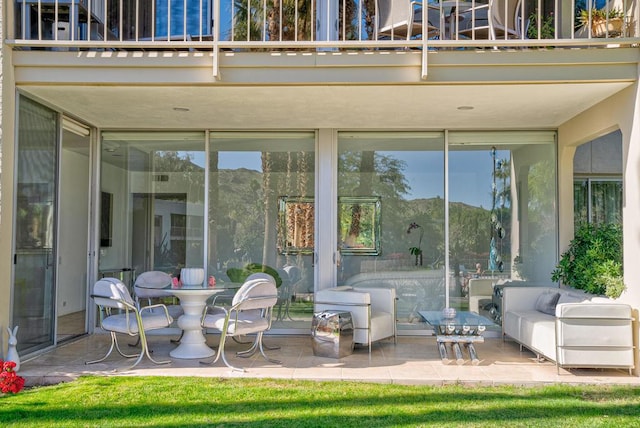 view of patio featuring a balcony