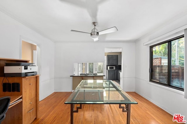 recreation room with ceiling fan, ornamental molding, and hardwood / wood-style flooring