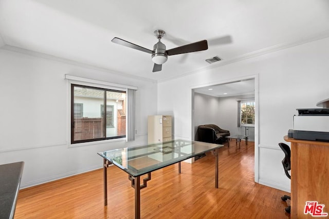 home office featuring hardwood / wood-style floors, ceiling fan, a healthy amount of sunlight, and ornamental molding