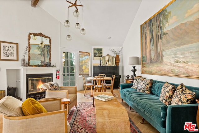 living room featuring hardwood / wood-style floors, high vaulted ceiling, and beam ceiling