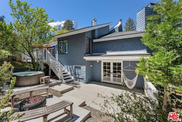 rear view of house featuring french doors and a patio