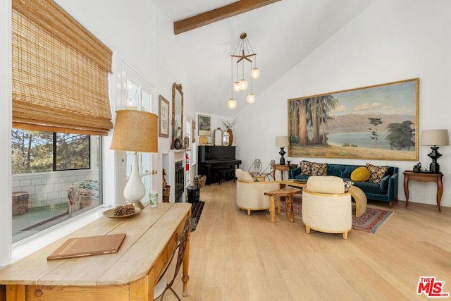 living room featuring beam ceiling, light wood-type flooring, high vaulted ceiling, and a notable chandelier