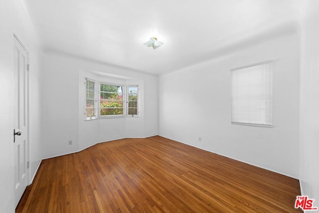 empty room featuring hardwood / wood-style flooring