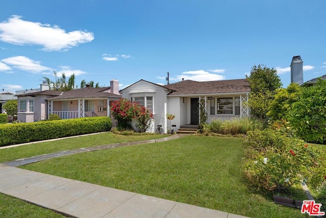 single story home featuring a front yard