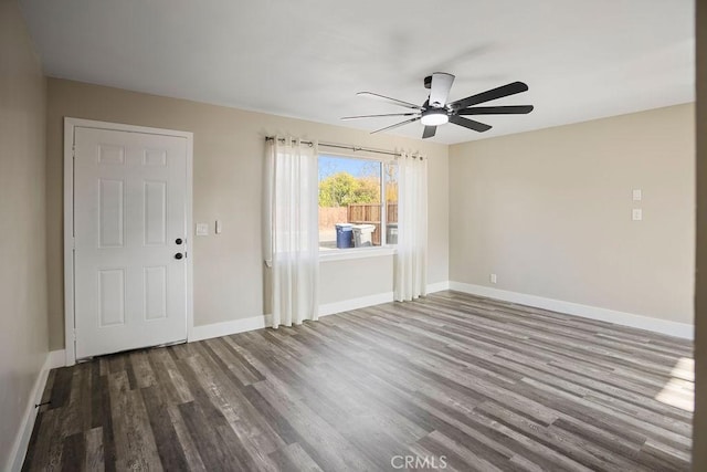 spare room featuring hardwood / wood-style floors and ceiling fan