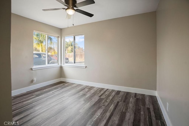 empty room featuring hardwood / wood-style flooring and ceiling fan