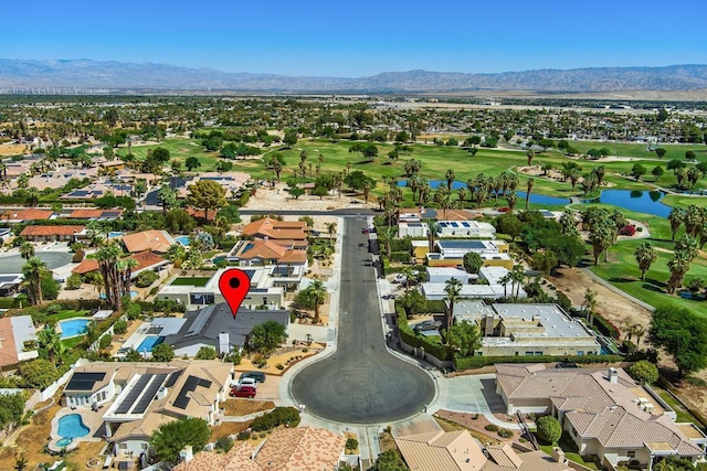 drone / aerial view with a water and mountain view