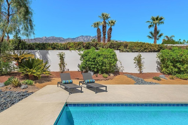 view of pool with a mountain view