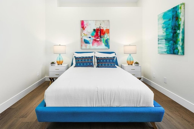 bedroom featuring dark hardwood / wood-style flooring