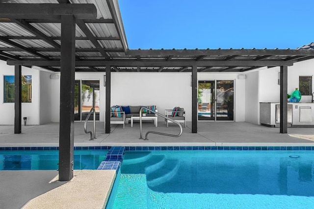 view of pool with an outdoor living space and a patio area