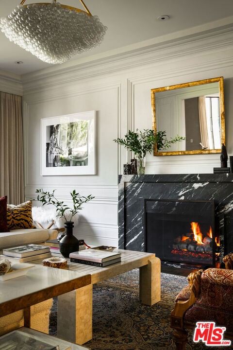 interior space featuring ornamental molding and a premium fireplace