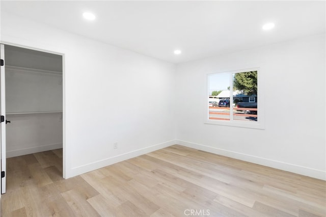 empty room with light hardwood / wood-style floors