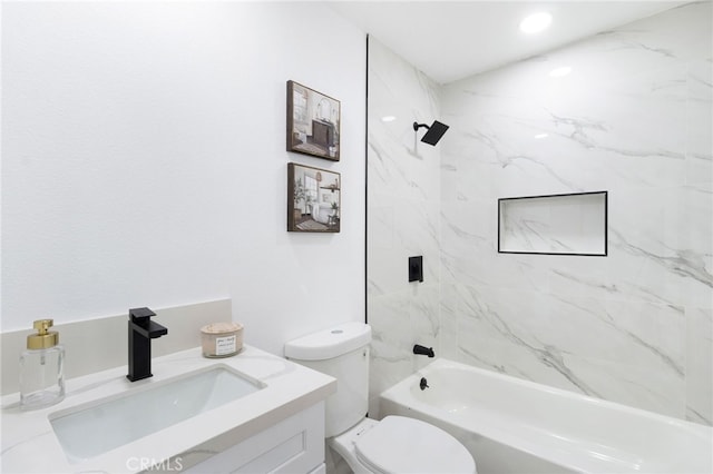 full bathroom with vanity, toilet, and tiled shower / bath