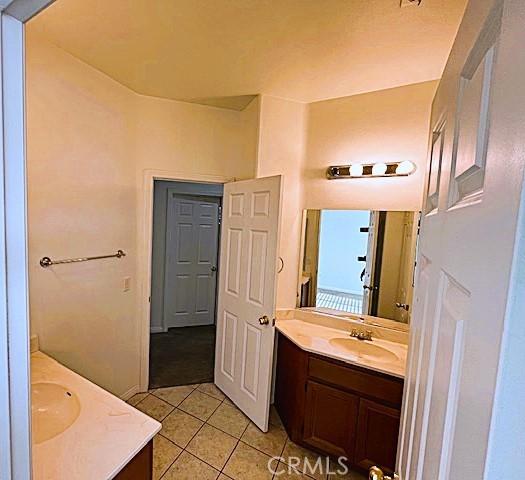 bathroom featuring tile patterned floors and vanity