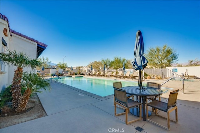 view of swimming pool featuring a patio area