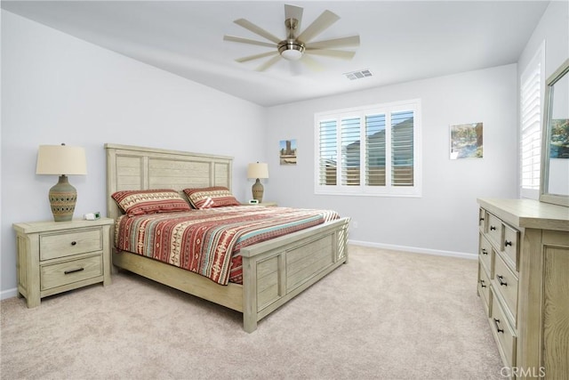 bedroom with ceiling fan and light carpet