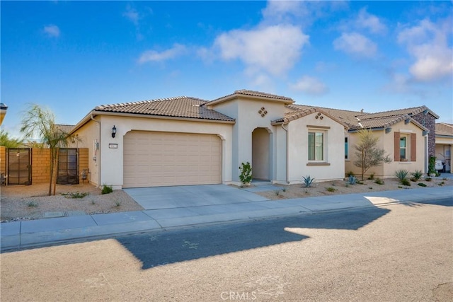 mediterranean / spanish-style home featuring a garage