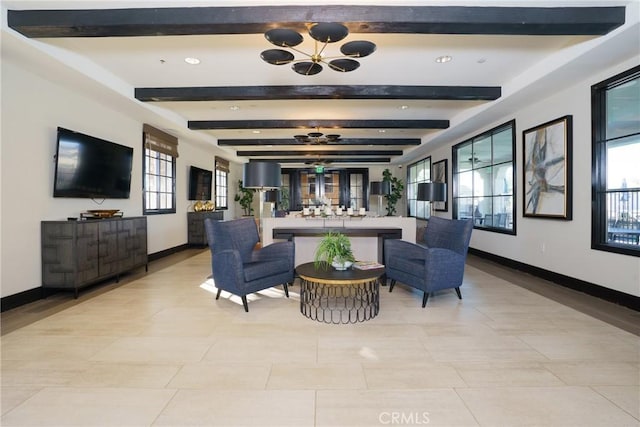 tiled living room featuring beam ceiling, a healthy amount of sunlight, and a notable chandelier