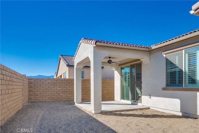 exterior space with a patio and ceiling fan