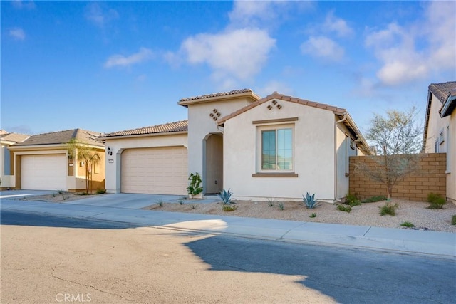 mediterranean / spanish-style house featuring a garage