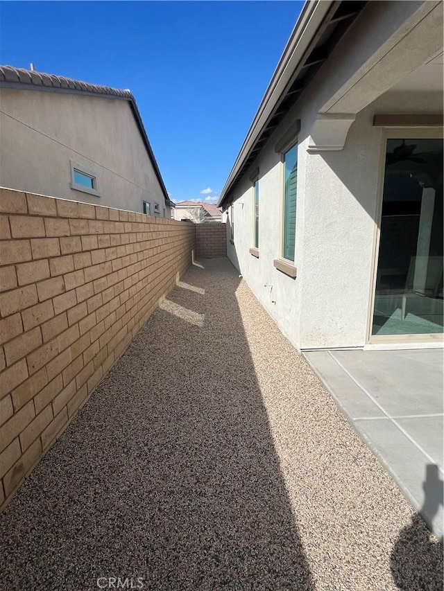 view of side of home featuring a patio area