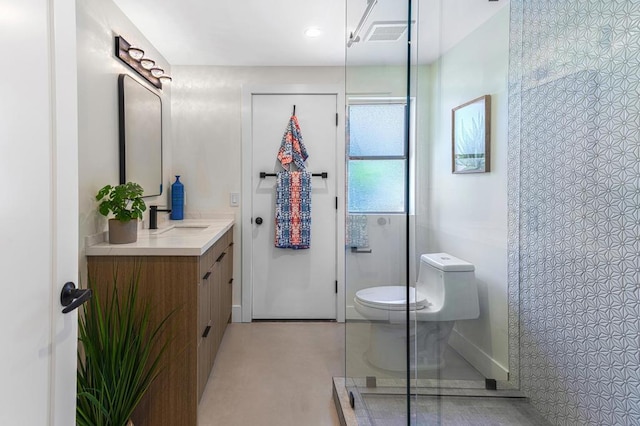 bathroom featuring vanity, toilet, and walk in shower