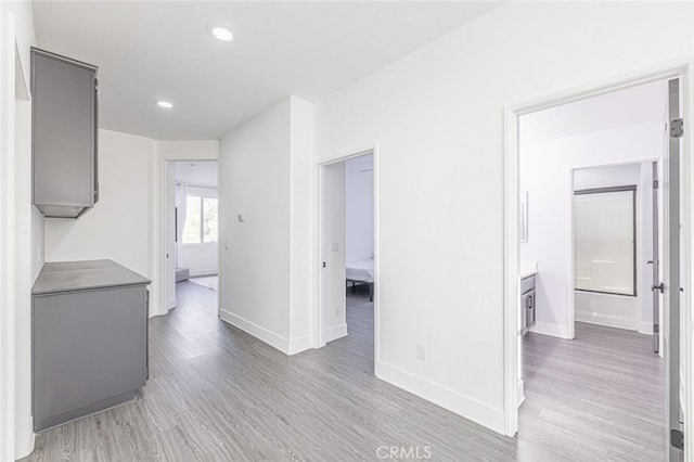 corridor featuring light hardwood / wood-style flooring