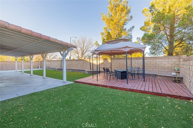 view of yard with a gazebo and a wooden deck