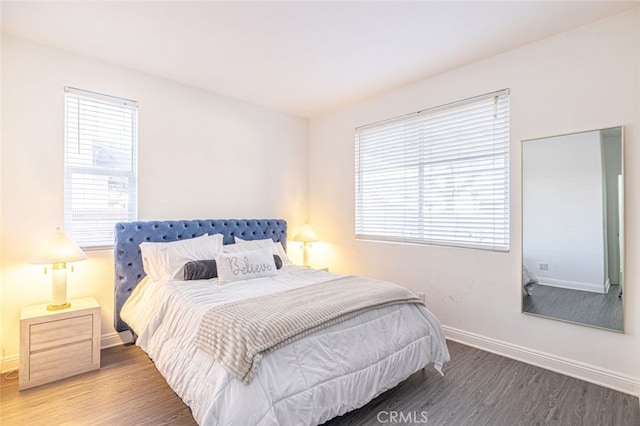 bedroom with hardwood / wood-style floors