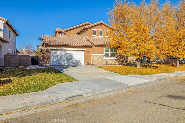 view of front of house with a garage and a front lawn