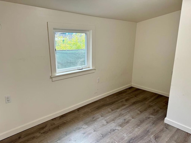 spare room with hardwood / wood-style floors